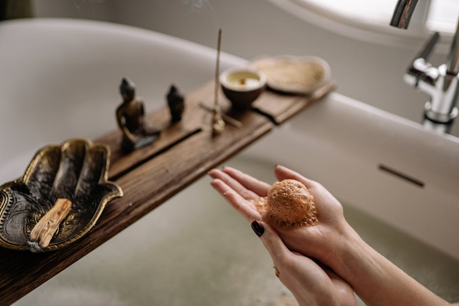 DIY home spa with a wet bath bomb in hands