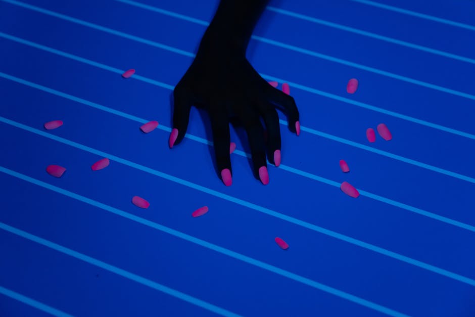 Hand with a custom pink manicure