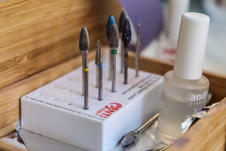 Manicure tools laid out in a wooden box