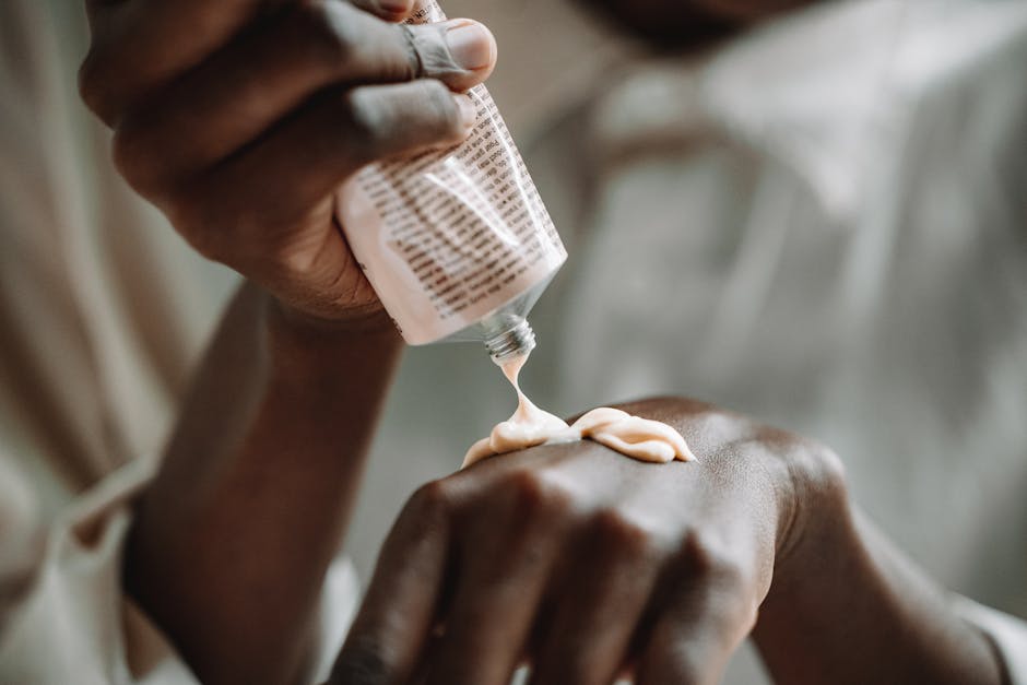 Person applying healing cream to their hand